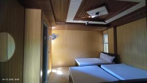 Ένα ή περισσότερα κρεβάτια σε δωμάτιο στο kiyomi's Inn