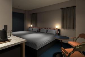 Ένα ή περισσότερα κρεβάτια σε δωμάτιο στο BASE LAYER HOTEL Fukuoka