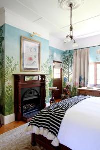 En eller flere senge i et værelse på Le Grand Jardin Villa