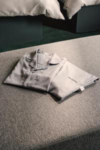 Ένα ή περισσότερα κρεβάτια σε δωμάτιο στο BASE LAYER HOTEL Fukuoka