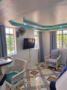 Μια τηλεόραση ή/και κέντρο ψυχαγωγίας στο Casa De Amor Suites