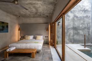 Ένα ή περισσότερα κρεβάτια σε δωμάτιο στο Basico Pixoy Hotel