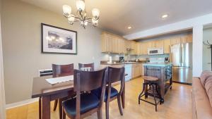 a kitchen and dining room with a table and chairs at Western Slopes Villas #7 condo in Mammoth Lakes