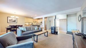 a living room with a couch and a table at Western Slopes Villas #7 condo in Mammoth Lakes