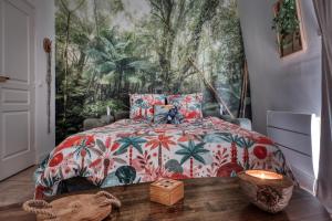 En eller flere senge i et værelse på Green Oasis Proche Gare & Disneyland