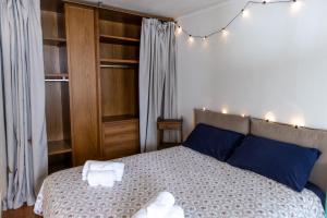 Postel nebo postele na pokoji v ubytování Pila- ski in ski out- appartamento YUMI