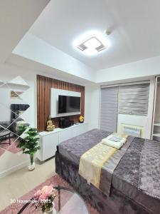 Ένα ή περισσότερα κρεβάτια σε δωμάτιο στο Azure North Bali 26th