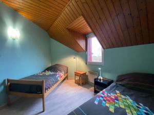 Ένα ή περισσότερα κρεβάτια σε δωμάτιο στο Gite des Compans