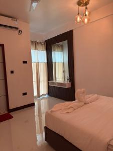 Ένα ή περισσότερα κρεβάτια σε δωμάτιο στο Bonthi Grand +6 φωτογραφίες