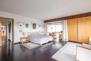 a bedroom with a bed and a large window at Maison Percheronne by Green Folies, 15p & piscine in La Gaudaine +15 photos