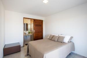 Giường trong phòng chung tại Casa Porpora Cumbuco