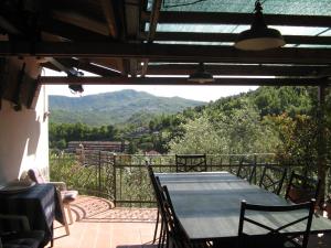 a table and chairs on a balcony with a view at Rosa dei Venti in Rapallo