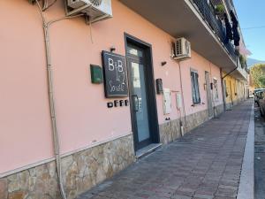 a building with a sign on the side of a street at B&B Le due sorelle in Telese