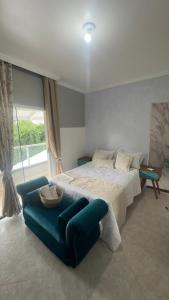 Ένα ή περισσότερα κρεβάτια σε δωμάτιο στο Residência da Kel