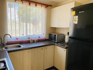 Η κουζίνα ή μικρή κουζίνα στο Casa completa amplia terraza y estacionamiento