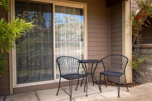 two chairs and a table on a porch at The Bard's Inn - BW Signature Collection by Best Western in Ashland +86 photos
