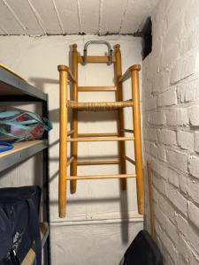 a wooden ladder hanging on a wall at Malouki Koksijde - 4 star appartment with magnificent sea view in Koksijde