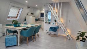 a kitchen and dining room with a table and chairs at Villa Aurora in Waldbrunn