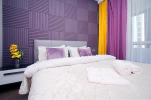 En eller flere senge i et værelse på Lavender Raf