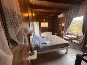 a small bedroom with a bed and a table at Le Dimore Del Sarto Polignano a mare in Polignano a Mare +195 photos