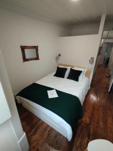 Ένα ή περισσότερα κρεβάτια σε δωμάτιο στο Pátio Da Gata