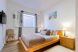 En eller flere senge i et værelse på Villa Machico Valley Flat 2