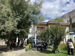 a group of people standing in front of a building at Baltipa Homestay in Pānāmik