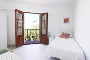 En eller flere senge i et værelse på Casa Miramar Spainsunrentals