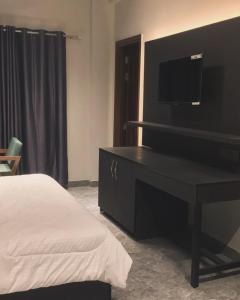 Ένα ή περισσότερα κρεβάτια σε δωμάτιο στο Hotel Star Moon