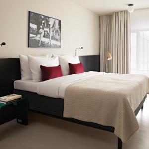 Postel nebo postele na pokoji v ubytování Numa Berlin Savi