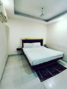 Ένα ή περισσότερα κρεβάτια σε δωμάτιο στο Hotel Star Moon