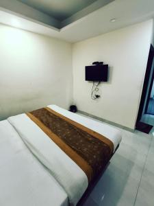 Ένα ή περισσότερα κρεβάτια σε δωμάτιο στο Hotel Star Moon