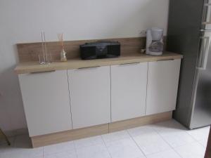 a kitchen with a counter with a microwave on it at Douillet F1 Place Paoli in Corte +6 photos