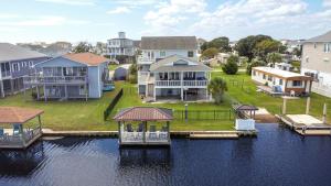 a group of houses on the water with a dock at Dig'n It in West Onslow Beach