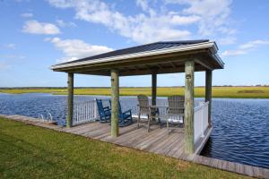 a gazebo on a dock on a lake at Dig'n It in West Onslow Beach