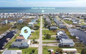 arial view of a residential suburb with a purple beach address at Dig'n It in West Onslow Beach