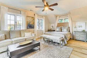 a living room with a bed and a couch at Steps to Lake Arrowhead Village Chic Apartment in Lake Arrowhead