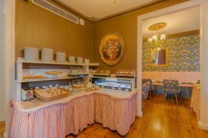 a room with a table with food on it at Solar dos Poetas in Lisbon