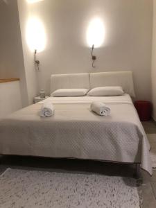 Una cama o camas en una habitación de Casa Maria Maddalena 5 fotos más