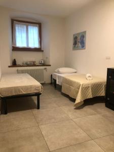 Una cama o camas en una habitación de Casa Maria Maddalena