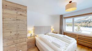 En eller flere senge i et værelse på Apartment Holiday Park 15 + 9 billeder