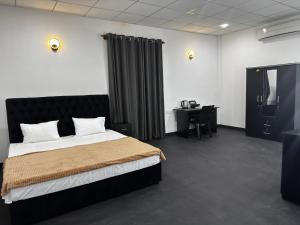 En eller flere senge i et værelse på Amore Beach Resort