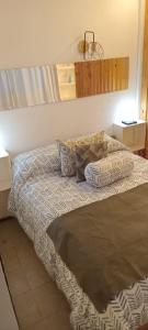 Ένα ή περισσότερα κρεβάτια σε δωμάτιο στο Departamento monoambiente amplio