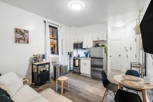 a living room with a couch and a table at Private One Bedroom Apartment in Times Square & Central Park in New York