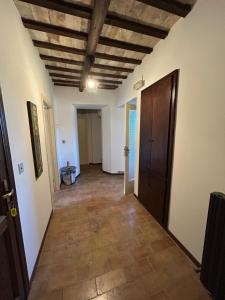 a hallway with a room with a wooden ceiling at Il Cantico in Cagli