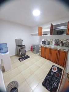 a kitchen with a stove and a counter top at Delightfulstaycation in Nanyuki