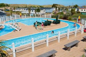 a group of people playing in a swimming pool at frankys presthaven retreat in Talacre