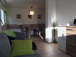 a living room with a couch and a table at Ferienwohnungsvermietung Leitel in Brandenburg an der Havel
