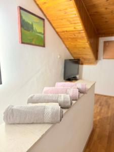 a row of towels sitting on a counter in a room at Cozy two room maisonette apartment in Samokov