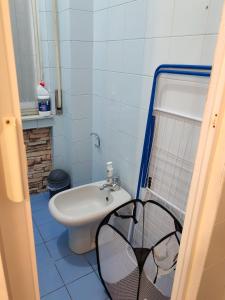 a small bathroom with a sink and a toilet at Casa PALLINA FIDENZA in Fidenza
